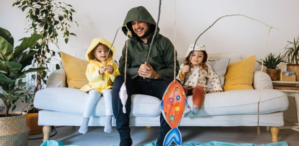A dad is playing with his two kids at home, fun kids games, educational activities